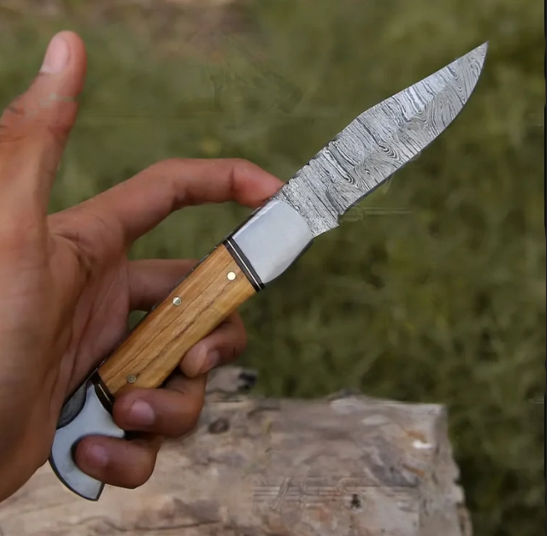 Damascus steel pocket knife featuring a back lock mechanism