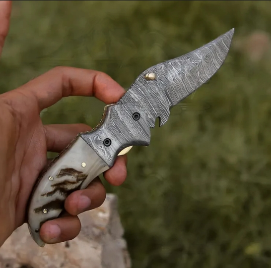 Handmade Damascus folding knife with authentic ram horn handle