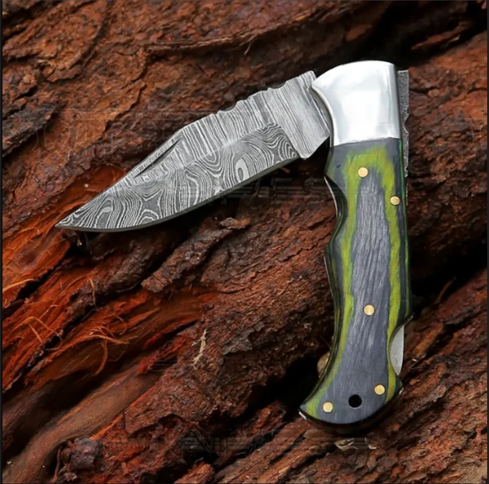 6.5-inch Damascus green folding knife with a solid wood handle