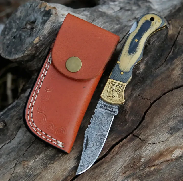 HANDMADE DAMASCUS STEEL FOLDING KNIFE WITH SHEATH	- STAIN WOOD HANDLE WITH ENGRAVED BRASS EAGLE BOLSTER WH 5048