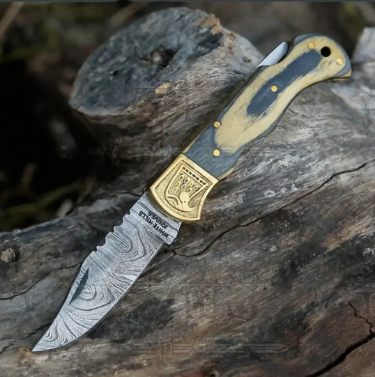 HANDMADE DAMASCUS STEEL FOLDING KNIFE WITH SHEATH	- STAIN WOOD HANDLE WITH ENGRAVED BRASS EAGLE BOLSTER WH 5048