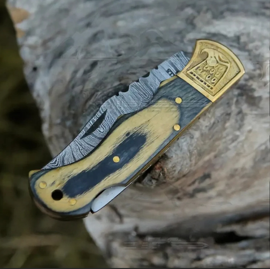 HANDMADE DAMASCUS STEEL FOLDING KNIFE WITH SHEATH	- STAIN WOOD HANDLE WITH ENGRAVED BRASS EAGLE BOLSTER WH 5048