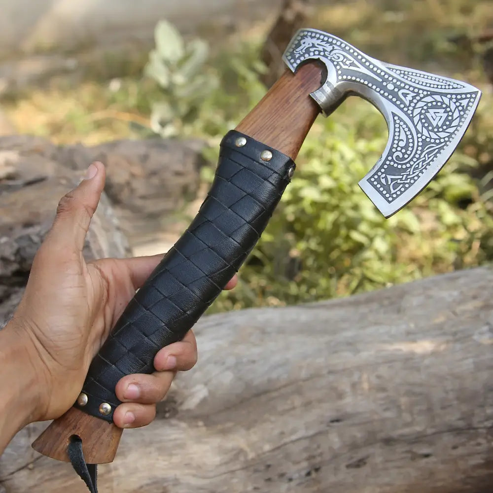 Small forged carbon steel axe with ash wood handle
 